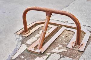 Manual car parking barrier with padlock in city photo