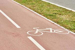 Empty bicycle path in city street photo