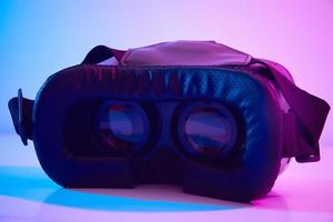 Virtual reality glasses on colorful background. Future technology, VR concept photo
