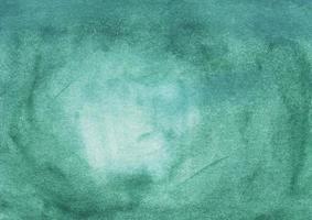 Watercolor dark sea green background texture with space for text. Aquarelle emerald abstract backdrop. photo