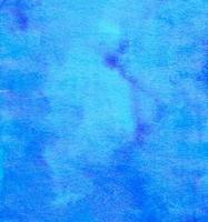 Watercolor blue background painting texture with space for text. Textured backdrop. Stains on paper. photo
