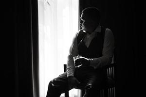portrait of the groom of a man in the morning before the wedding photo
