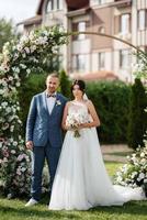 wedding ceremony of the newlyweds on the glade photo