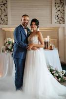 the first dance of the bride and groom inside a restauran photo