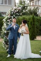 wedding ceremony of the newlyweds on the glade photo