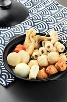 Japanese Oden. Vegetables, Fish Dumplings Skewers Soup photo