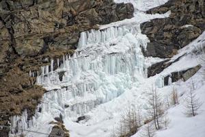 icicles detail in snow winter time photo