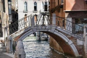 Venice canal bridge view photo