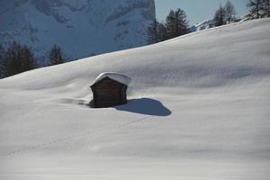 A wood cabin hut in the winter snow background photo