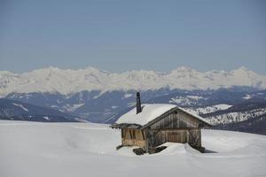 Wood hut on huge panorama view in winter time photo