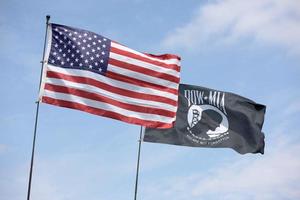 American flag along with the P.O.W flag photo