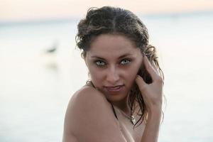 Grey and green eyes of beautiful latina girl photo