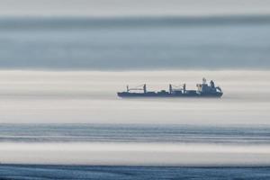 Ship in the fog background photo