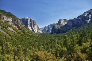 A beautifuly sunny view of yosemite valley park half dome photo