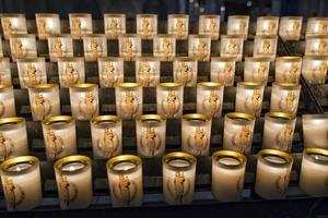 votive candles in paris cathedral photo