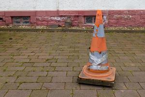 a road cone on a sidewalk photo