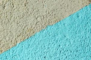 Painted wall with rough surface. Color wall background. photo