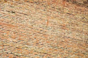 Angled view of red brick wall. Brick wall background. photo