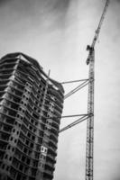 Black and white image of a modern multistory building construction. photo