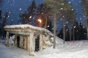 wooden cabin in snow background photo