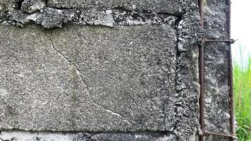 Corner adobe wall with corroded structural steel framing photo