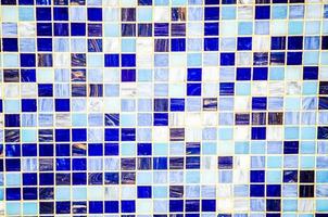 mosaic tiles wall in white blue pattern for background. photo