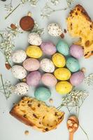 banner. Easter frame with eggs and feathers on a blue wooden background. Minimal concept. View from above. Card with copy space for text. photo