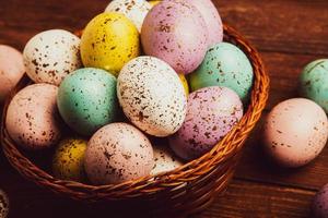 banner. Easter frame with eggs and feathers on a blue wooden background. Minimal concept. View from above. Card with copy space for text. photo