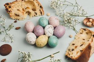 banner. Easter frame with eggs and feathers on a blue wooden background. Minimal concept. View from above. Card with copy space for text. photo