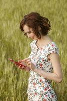 Beautiful woman or business woman talking on a cell phone outside. Outdoor portrait of a beautiful happy businesswoman talking on cell phone. photo