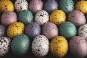 banner. Easter frame with eggs and feathers on a blue wooden background. Minimal concept. View from above. Card with copy space for text. photo