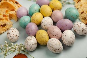 banner. Easter frame with eggs and feathers on a blue wooden background. Minimal concept. View from above. Card with copy space for text. photo