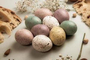 banner. Easter frame with eggs and feathers on a blue wooden background. Minimal concept. View from above. Card with copy space for text. photo