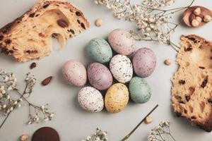 banner. Easter frame with eggs and feathers on a blue wooden background. Minimal concept. View from above. Card with copy space for text. photo