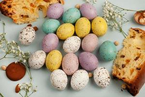 banner. Easter frame with eggs and feathers on a blue wooden background. Minimal concept. View from above. Card with copy space for text. photo