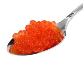 Red sturgeon caviar in a metal spoon on a white isolated background, delicious snack photo