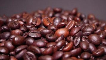Freshly roasted coffee beans close up video