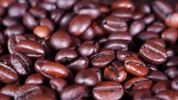 Freshly roasted coffee beans close up video