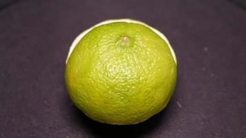 Lime on a black background rotates video