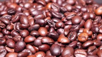 Freshly roasted coffee beans close up video