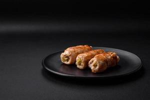 Delicious baked pork or chicken roll with mushrooms, spices and herbs inside photo