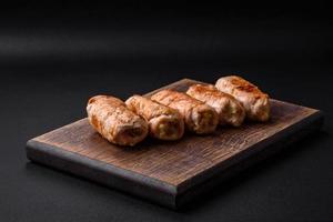 Delicious baked pork or chicken roll with mushrooms, spices and herbs inside photo