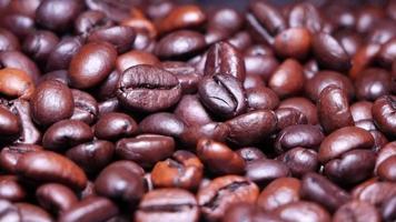 Freshly roasted coffee beans close up video