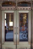 manhattan iron and glass skyscraper detail of sliding doors photo