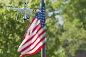 A security drone on stars and stripes USA flag photo