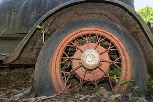 old abandoned car rugged tire photo