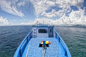 A boat on the reef in tropical paradise photo