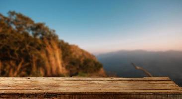 Empty top of wooden shelves on sky mountain and river trees front view background. For product display blur background image, for product display montage. photo