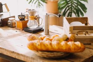 Professional barista preparing coffee using chemex pour over coffee maker and drip kettle. Alternative ways of brewing coffee. Coffee shop concept. photo