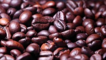 Freshly roasted coffee beans close up video